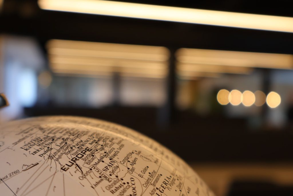 Close-up view of a globe focusing on Europe with a blurred background.