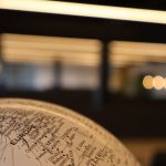 Close-up view of a globe focusing on Europe with a blurred background.